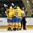 GRAND FORKS, NORTH DAKOTA - APRIL 18: Sweden's Timothy Liljegren #19 and teammates celebrate after a second period goal against Switzerland's Matteo Ritz #30 during preliminary round action at the 2016 IIHF Ice Hockey U18 World Championship. (Photo by Minas Panagiotakis/HHOF-IIHF Images)

